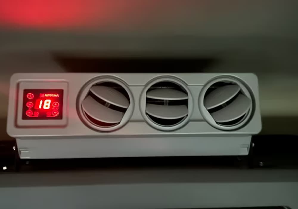 Air conditioning unit with three vents and a digital display. Air conditioning unit with three vents and a digital display.