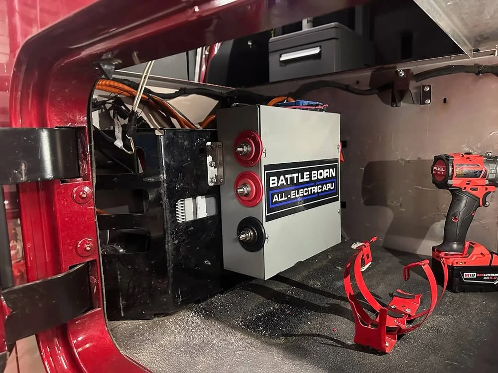Interior of a truck showing a Dragonfly Energy Battle Born batteries and tools.